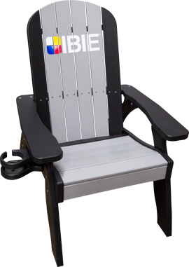 A black and gray deck chair made of recycled plastic lumber with IBIE logo decal on the back