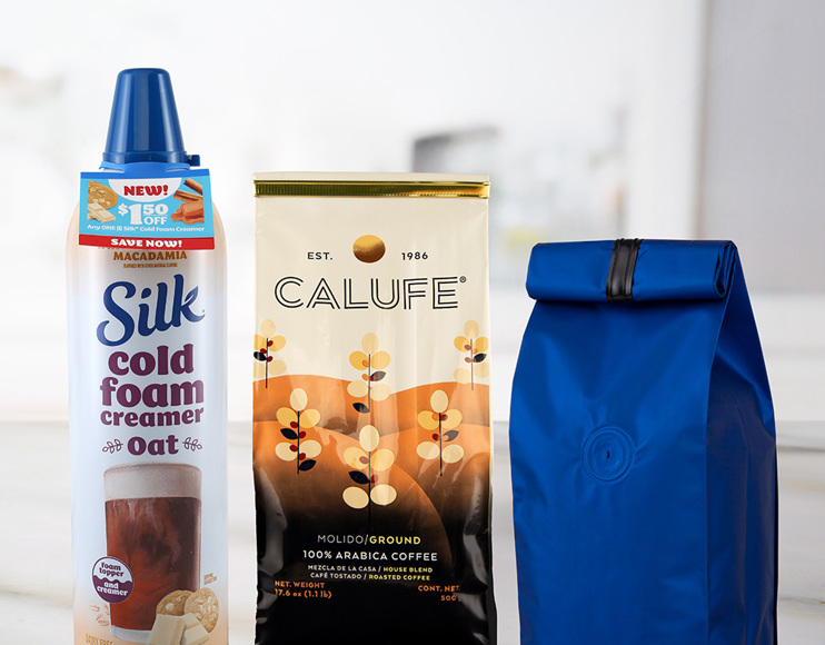 3 coffee items, including Silk cold foam creamer with ElastiTag coupon, Calufe brand coffee bag with gold metallic coffee tin tie, and unbranded blue coffee bag with black Roll N Close closure. 