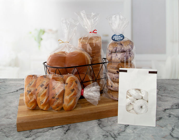 5 baked good items, including buns, rolls, bagels, bread, and powdered donuts, closed by Bedford twist tie, clip band, double wire tin-tie and CloseIt tag solutions. 