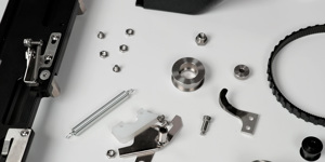 A variety of metal and black plastic crews, bolts, and parts