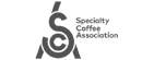 Logo of the Specialty Coffee Association, including a stylized 'S' design and the complete organization name in text.