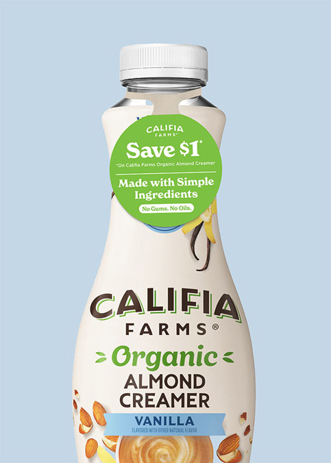 A bottle of Vanilla Califia Farms Organic Almond Creamer, with a white background. The bottle has a green and white tag with product details and $1 off coupon. 