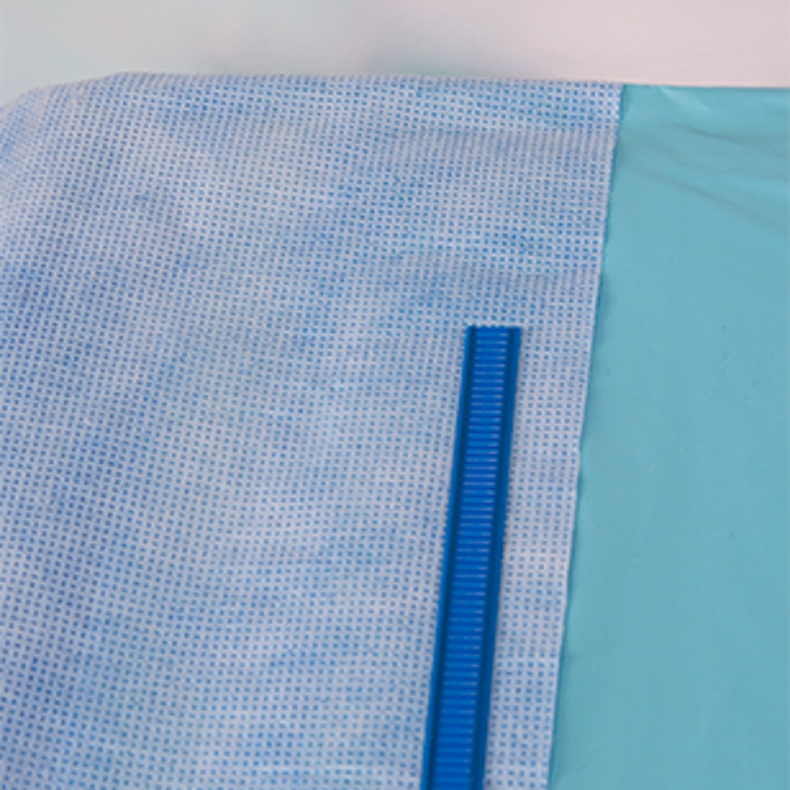 Flexible blue wire with adhesive attached to top of medical drape.