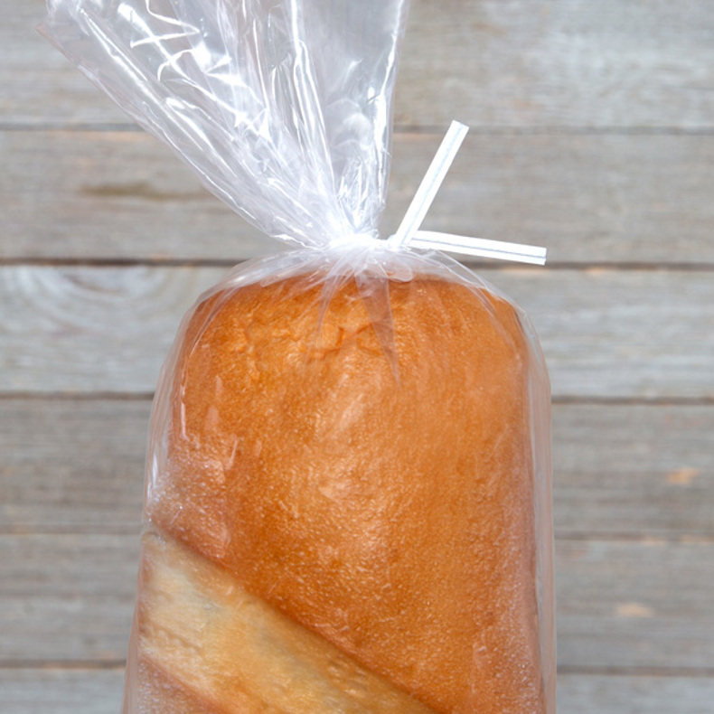 White bread twisty tie on french bread loaf