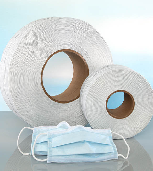 large and small spool of plastic nose tie and two blue disposable face masks with nose bridge strip.