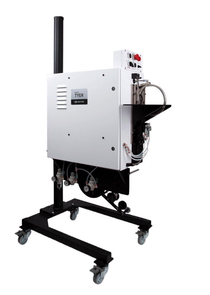 RingTyer Transparent white twist tie machine on black stand.
