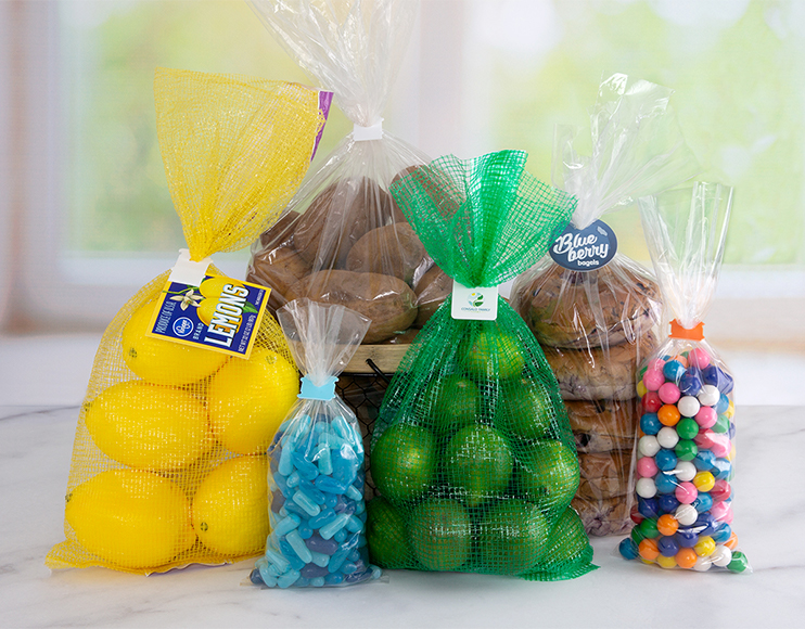 Plastic clip bag closures secure bags of lemons, limes, potatoes, and colorful hard candy.