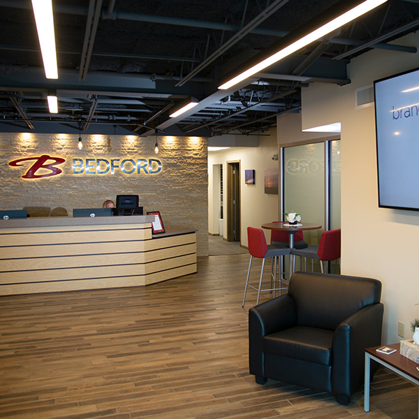 Bedford Industries’ front office lobby with seating and receptionist desk.