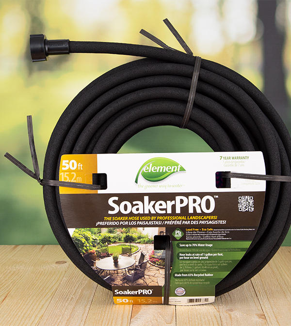 A black heavy duty twist tie keeps a large garden hose bundled.