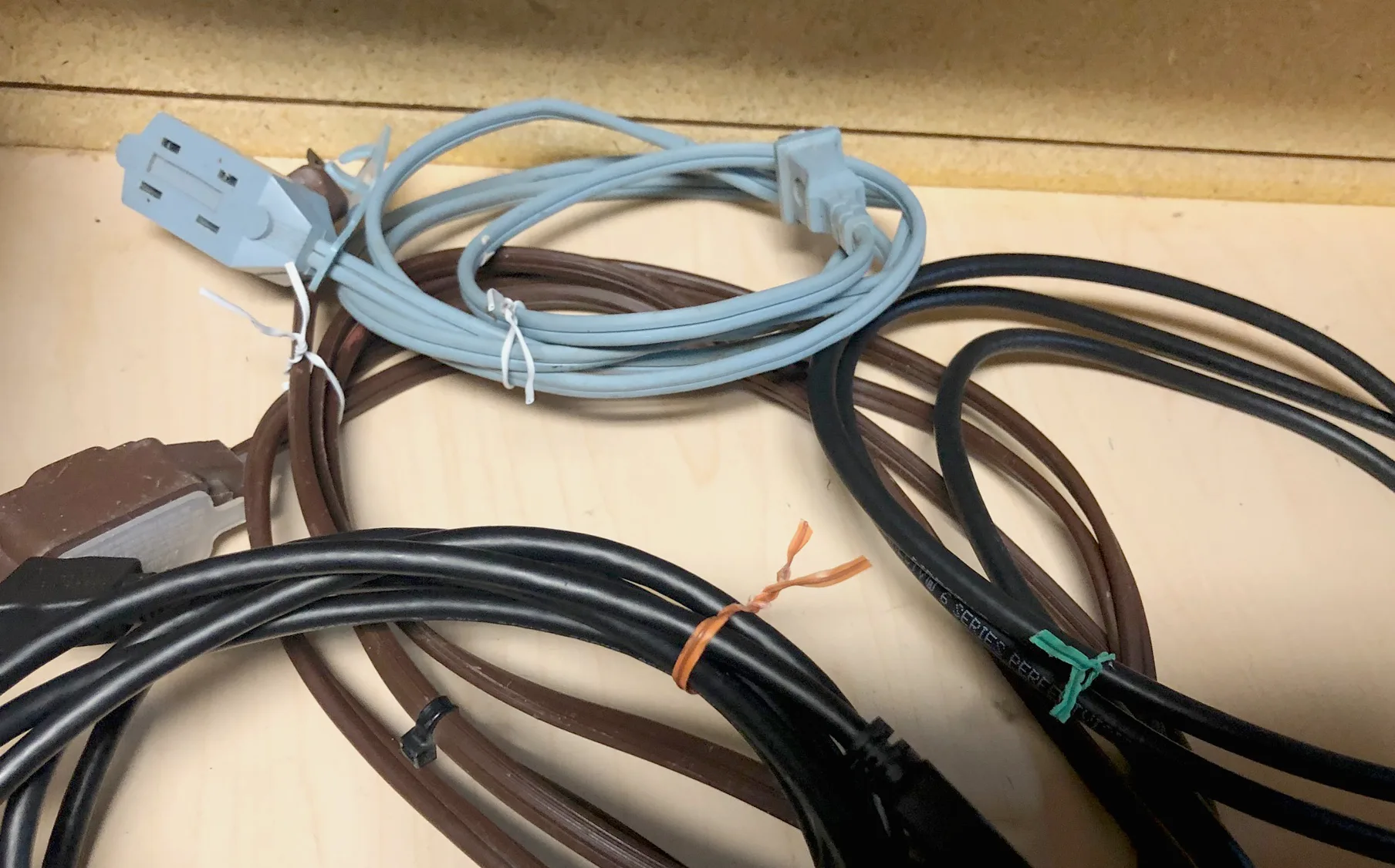 Various colored twist ties act as cord ties