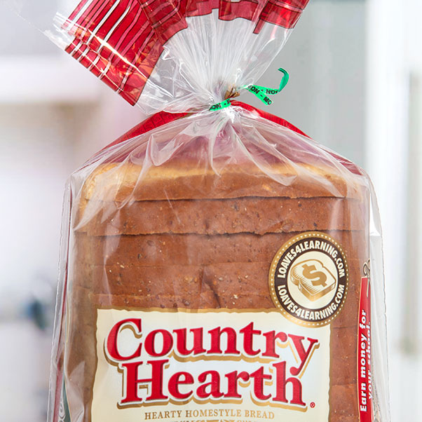 CountryHearth_12Grain A green printed twist tie closing a loaf of Country Hearth branded bread.
