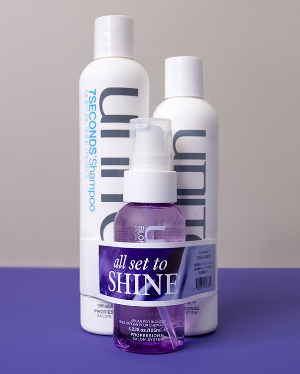 Unite_band Three Unite hair care products lined combined as a value pack that are banded together with an ElastiTag band.