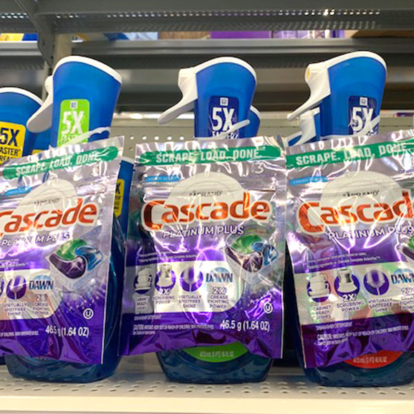 cascade A photo of three sample pouches of Cascade Dish Detergent affixed to a bottle of Dawn dish with an ElastiTag tab on a store shelf.